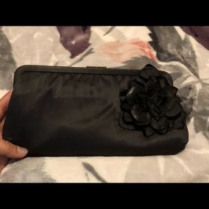 Black clutch with flower detail perfect for date